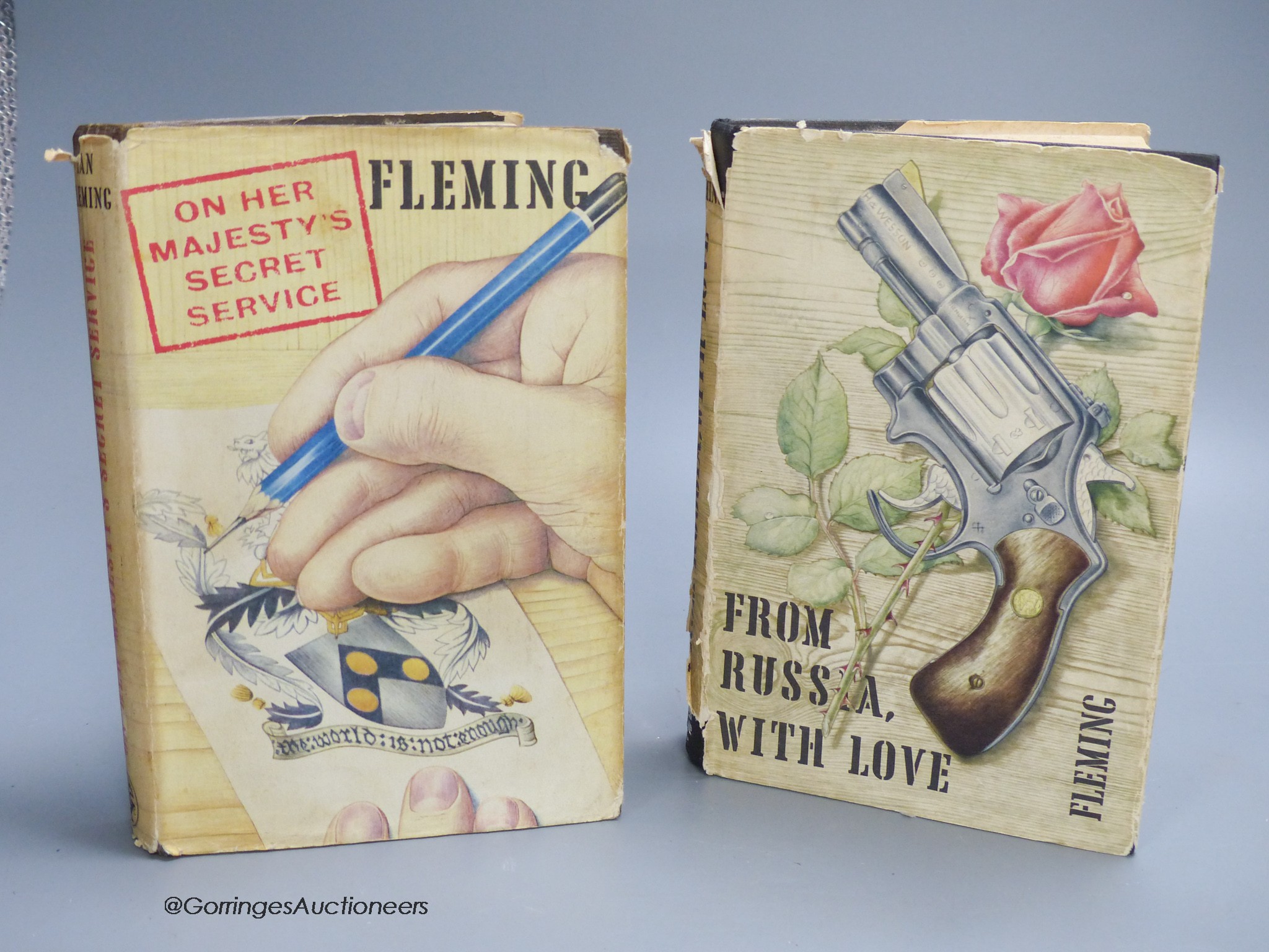 Fleming, Ian - On Her Majesty’s Secret Service, 1st edition, with unclipped d/j designed by Richard Chopping, original dark brown cloth with ski motif to front board, London, 1963; and From Russia With Love, 4th impressi